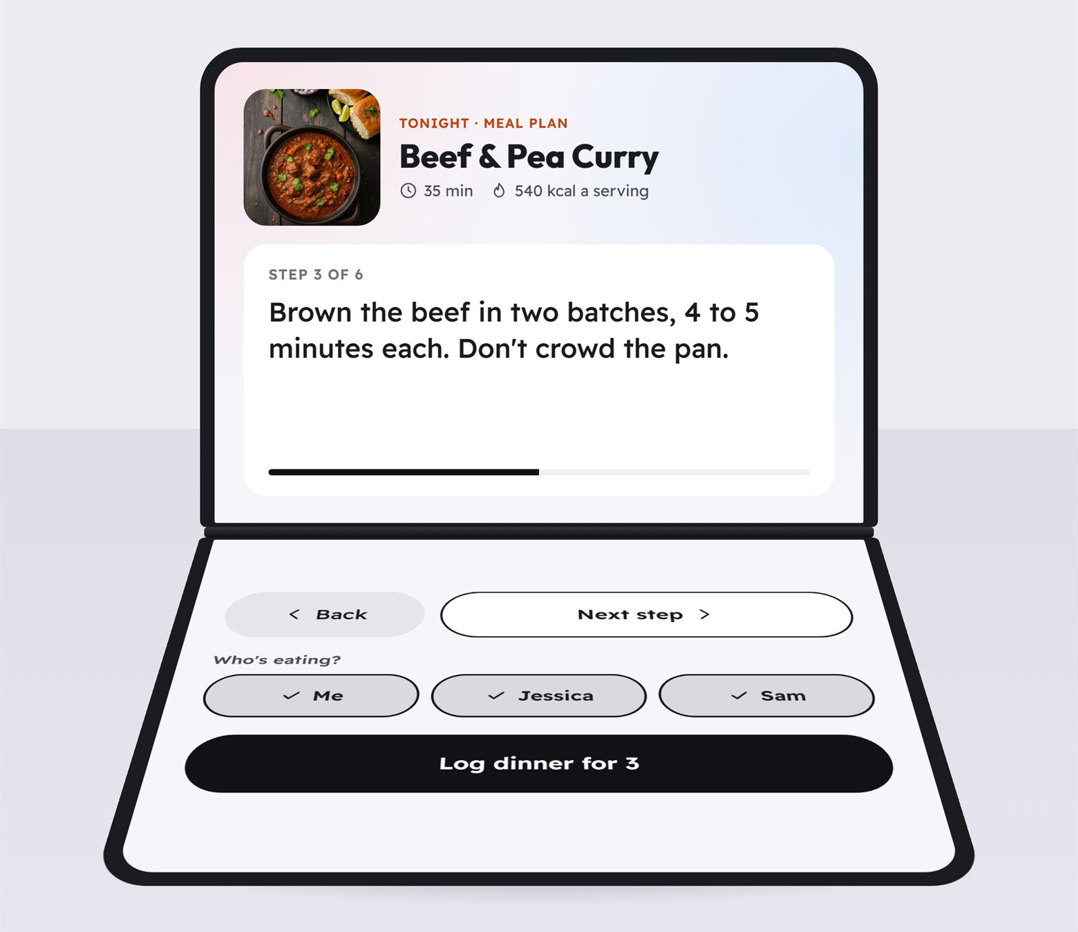 An iPhone Duo folded partway and standing on a counter. The upright half shows step 3 of a beef and pea curry recipe in large text. The flat half shows Back and Next step buttons, Who's eating chips for three people, and a Log dinner for 3 button.